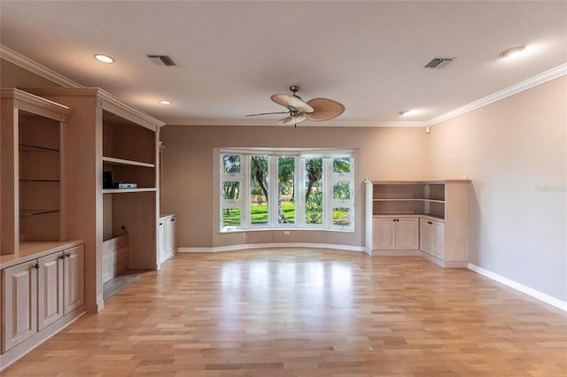 unfurnished living room with light wood finished floors, baseboards, visible vents, and crown molding