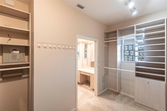 bathroom with visible vents, vanity, and baseboards