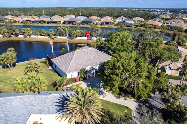 birds eye view of property featuring a water view and a residential view