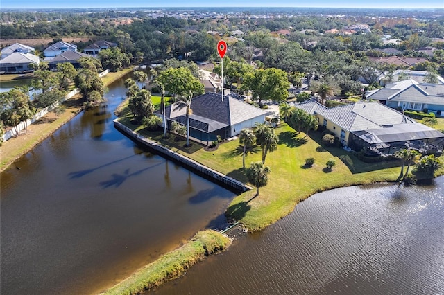 birds eye view of property with a water view and a residential view