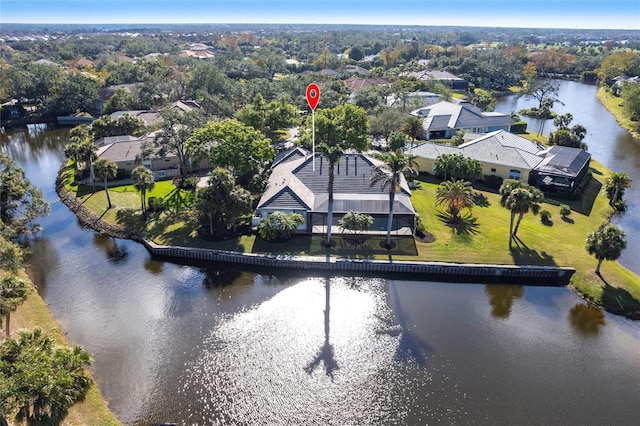 birds eye view of property with a water view and a residential view