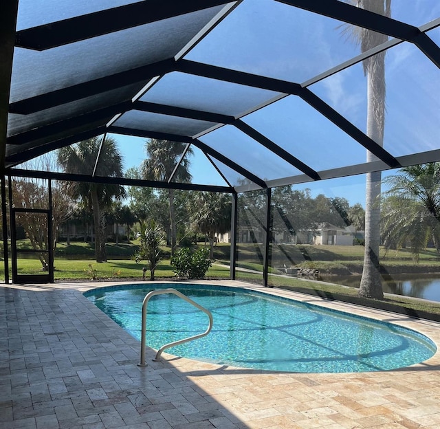 pool featuring a lanai and a patio area