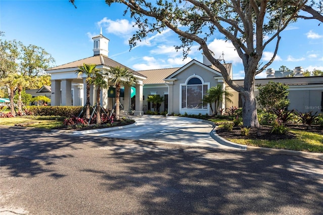 view of building exterior featuring concrete driveway