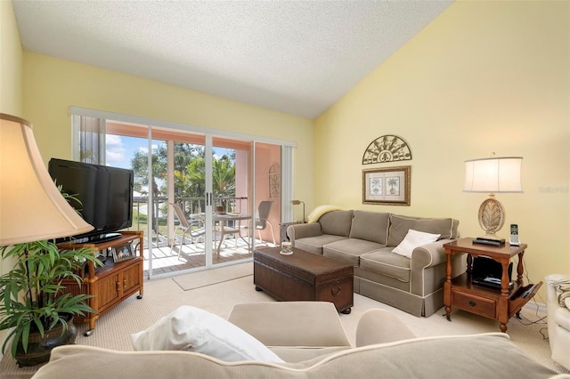 carpeted living room featuring vaulted ceiling and a textured ceiling