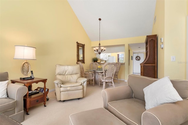 living room with an inviting chandelier, light colored carpet, and high vaulted ceiling