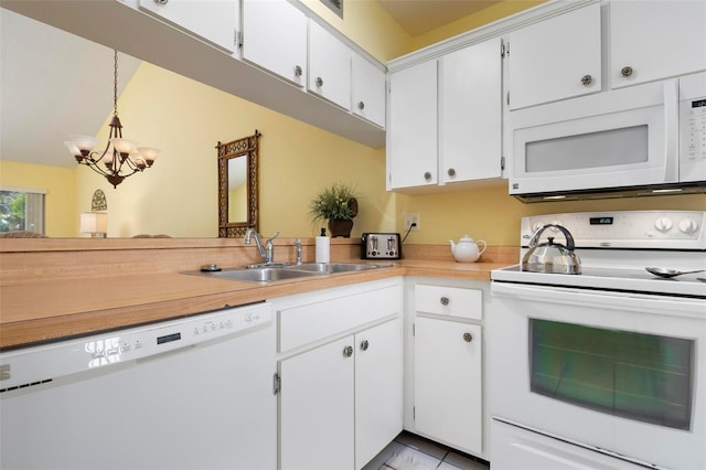 kitchen with pendant lighting, sink, white cabinets, white appliances, and an inviting chandelier