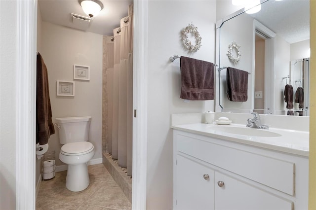 bathroom with tile patterned flooring, vanity, a shower with curtain, and toilet