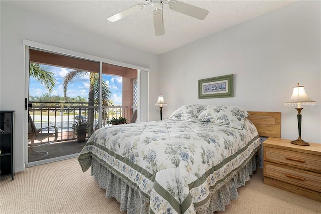 bedroom featuring access to exterior, ceiling fan, a textured ceiling, and carpet