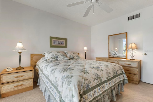 bedroom with ceiling fan and light colored carpet