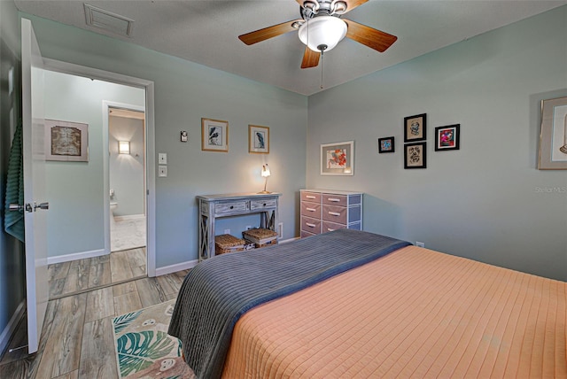 bedroom featuring light hardwood / wood-style floors and ceiling fan