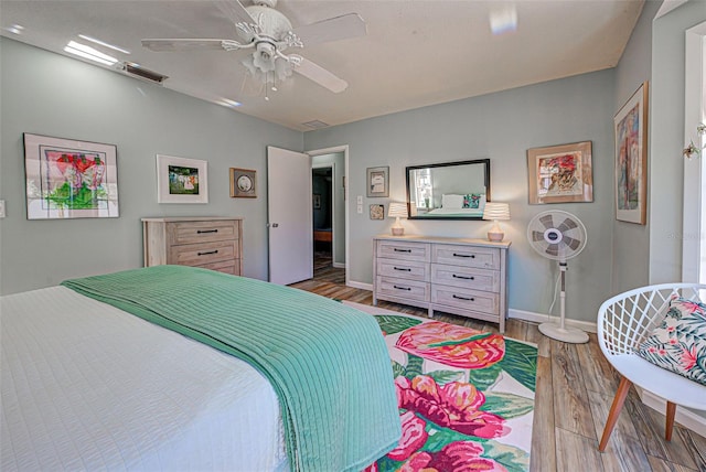 bedroom featuring ceiling fan and light hardwood / wood-style flooring