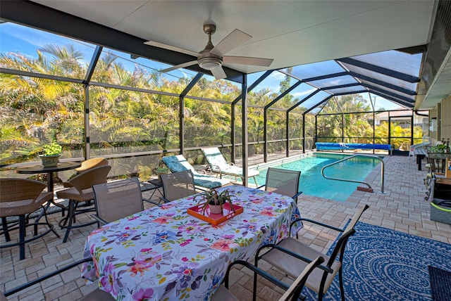 view of swimming pool with a lanai and a patio area