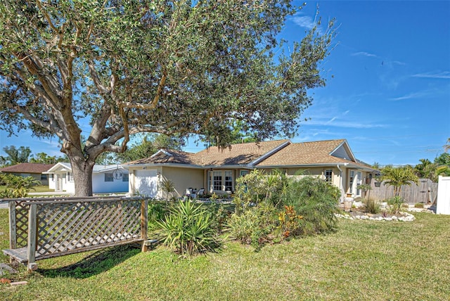 rear view of house with a yard