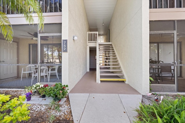 property entrance featuring stucco siding