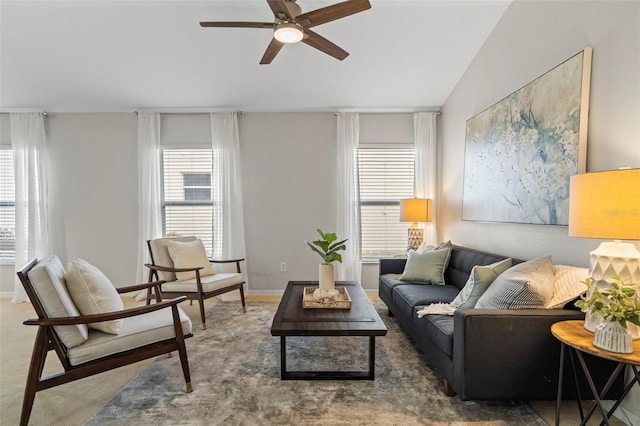 living room with lofted ceiling, carpet floors, and ceiling fan