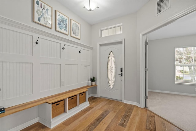 mudroom with light hardwood / wood-style flooring