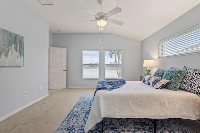 carpeted bedroom with multiple windows, vaulted ceiling, and ceiling fan