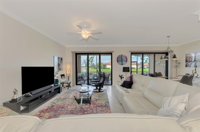 living room featuring crown molding and ceiling fan