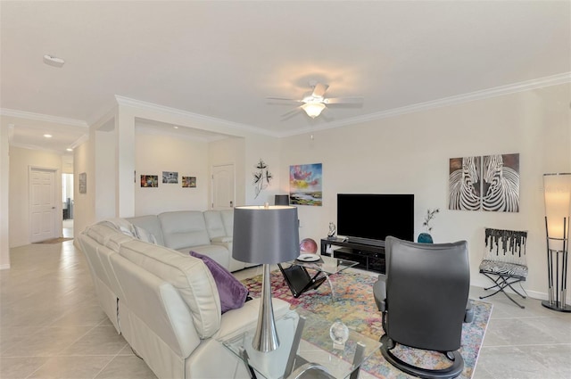 living room featuring ceiling fan, ornamental molding, and light tile patterned floors