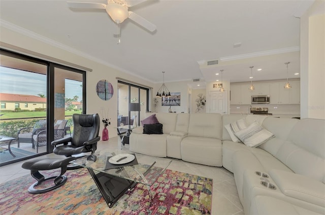 tiled living room featuring ceiling fan and ornamental molding