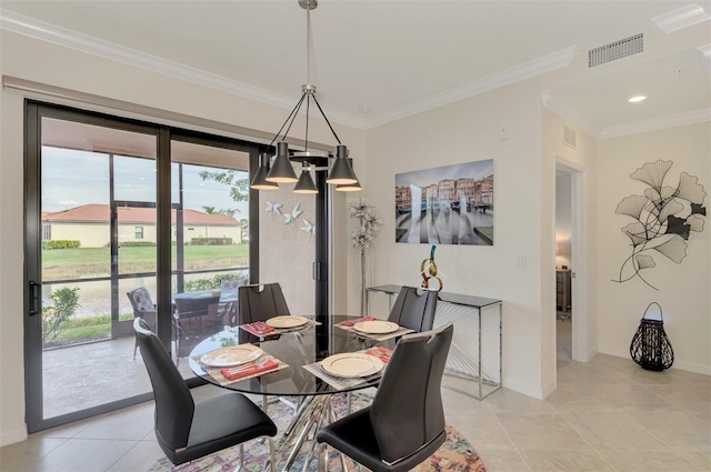 tiled dining space featuring crown molding and plenty of natural light