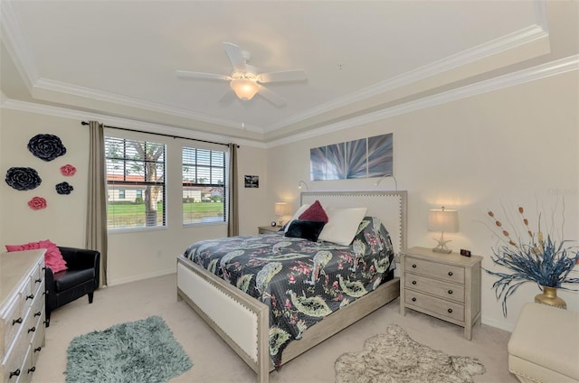 carpeted bedroom featuring crown molding and ceiling fan