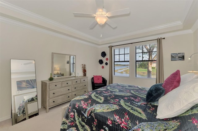 carpeted bedroom with crown molding and ceiling fan