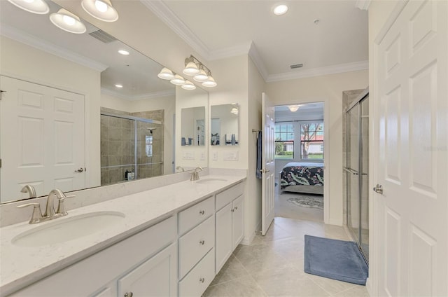 bathroom with an enclosed shower, vanity, tile patterned floors, and ornamental molding