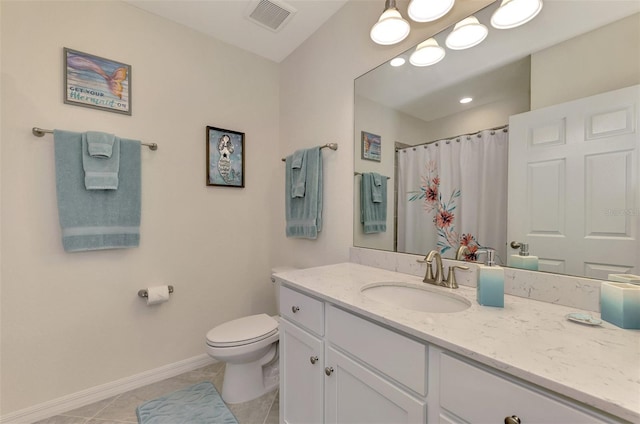 bathroom with vanity, curtained shower, tile patterned floors, and toilet