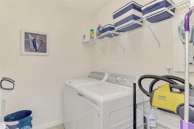 clothes washing area featuring washer and clothes dryer