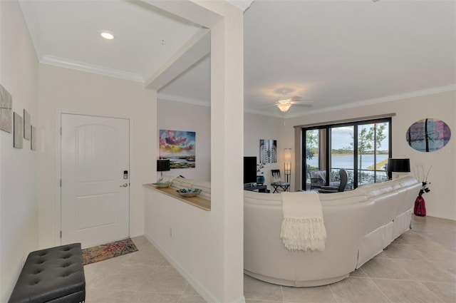 living room with crown molding, ceiling fan, and light tile patterned floors