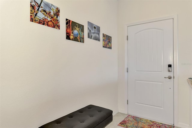 doorway to outside featuring light tile patterned floors