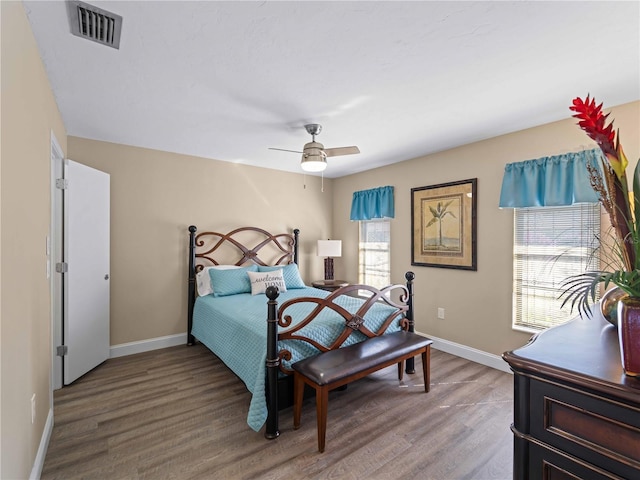 bedroom with hardwood / wood-style flooring and ceiling fan