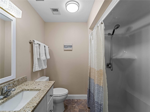 bathroom with vanity, toilet, and a shower with shower curtain