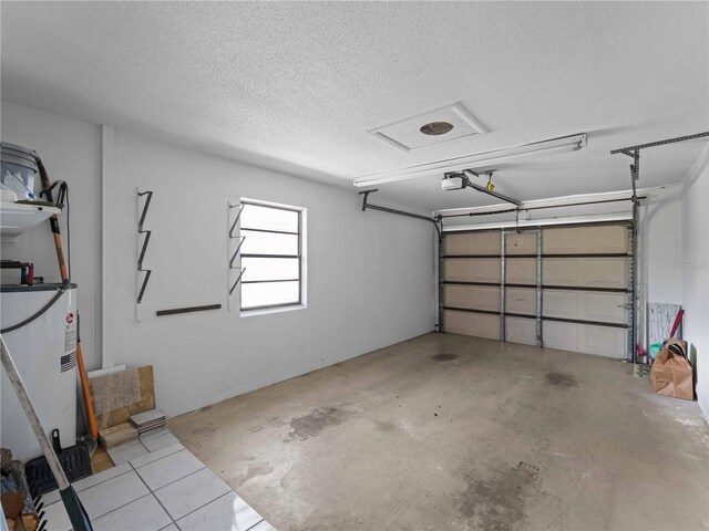 garage with a garage door opener and water heater