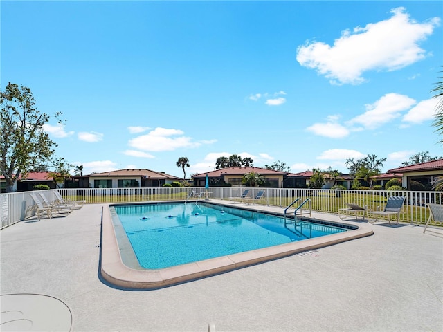 view of swimming pool featuring a patio area