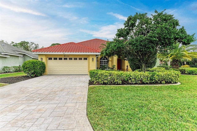 view of front facade with a garage and a front lawn