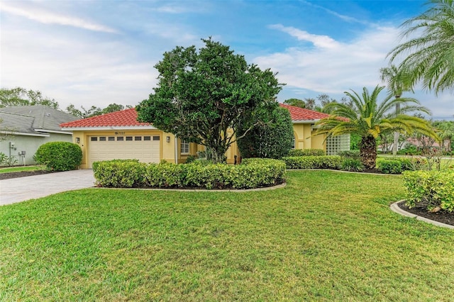 mediterranean / spanish-style home with a garage and a front lawn