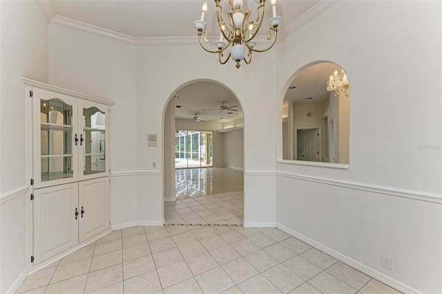 unfurnished dining area with light tile patterned floors, crown molding, and ceiling fan with notable chandelier