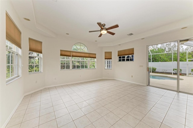 spare room with light tile patterned floors and ceiling fan