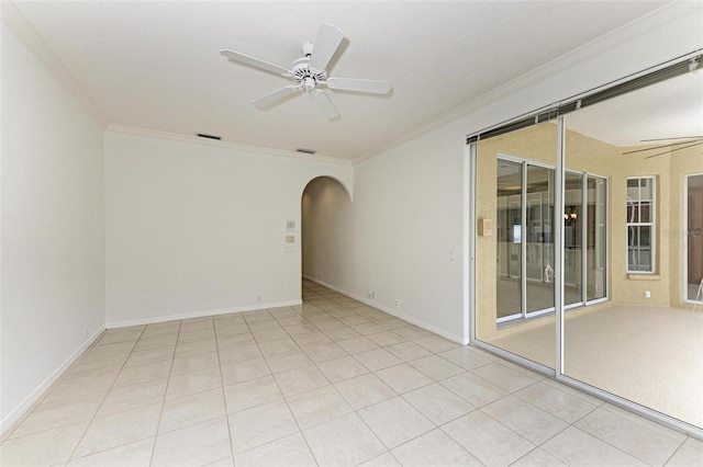 tiled empty room with crown molding, ceiling fan, and a textured ceiling