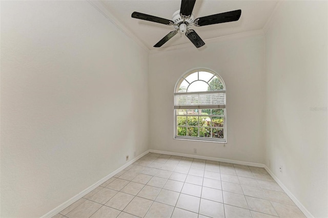 tiled empty room with crown molding and ceiling fan