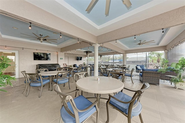 interior space with ceiling fan and an outdoor hangout area