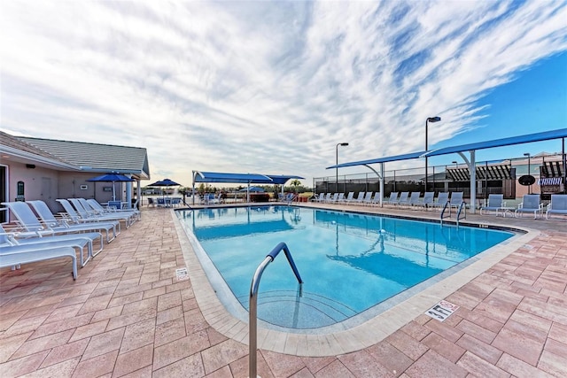 view of swimming pool with a patio