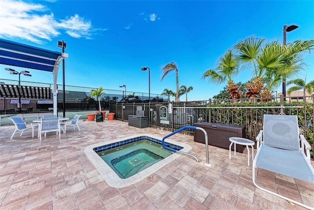 view of pool featuring a community hot tub and a patio