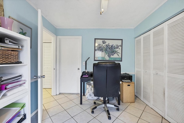 office area with ornamental molding and light tile patterned floors