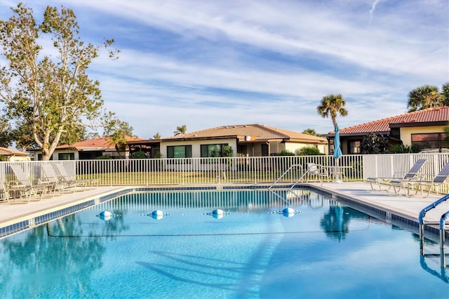 view of swimming pool with a patio