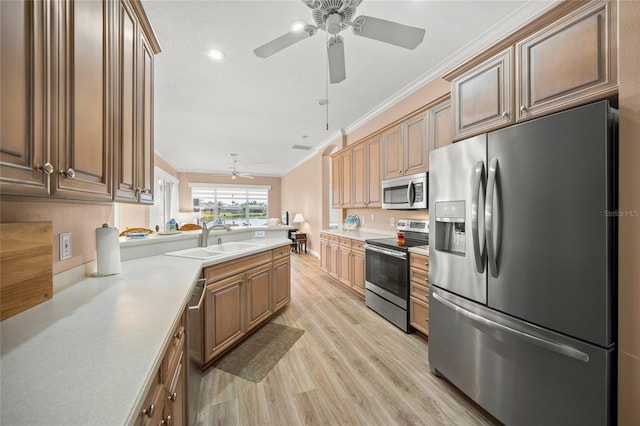 kitchen with sink, light hardwood / wood-style flooring, appliances with stainless steel finishes, ornamental molding, and kitchen peninsula