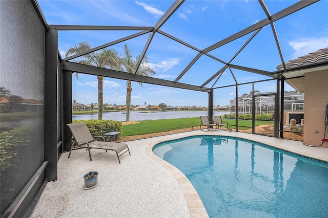 view of pool featuring a patio, a water view, a yard, and glass enclosure