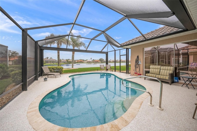 view of pool with a water view, a lanai, and a patio